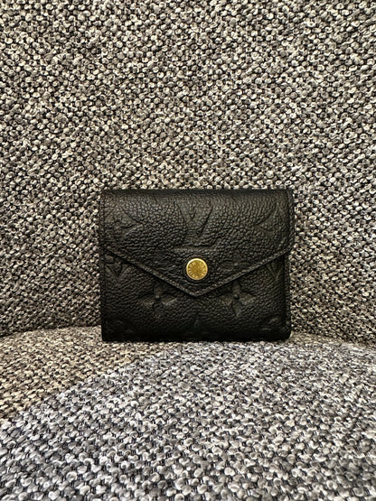 Louis Vuitton Zoe Wallet In Black Embossed Empreinte Leather