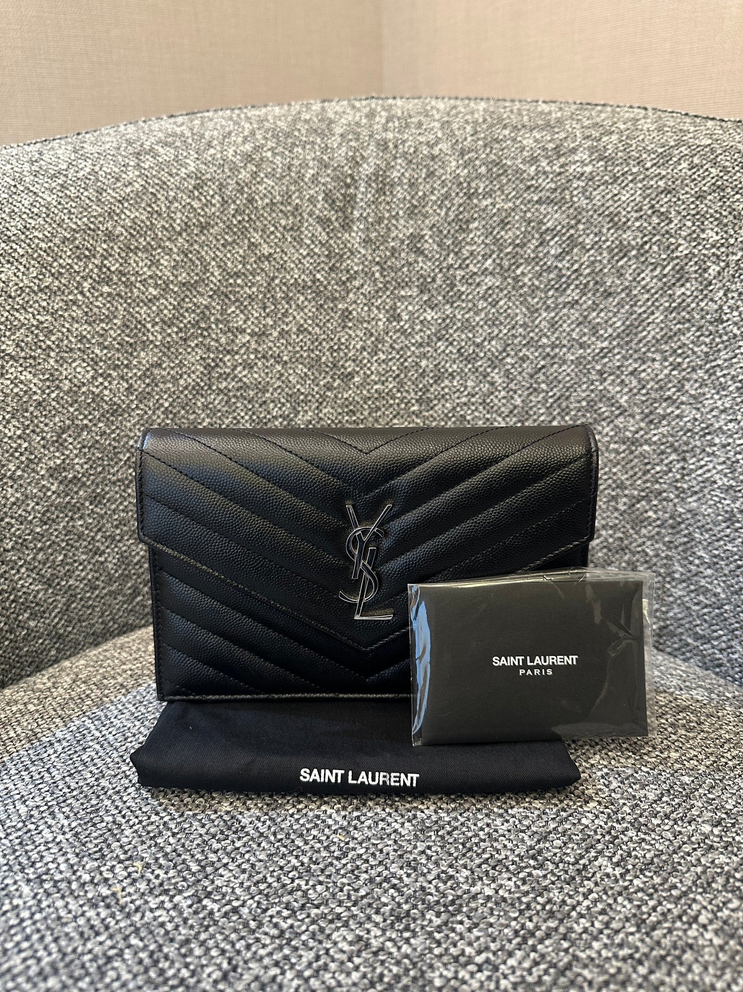 Yves Saint Laurent Cassandre WOC in Quilted Black Leather with Silver Hardware