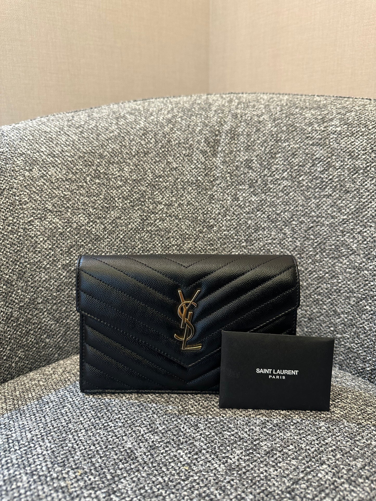 Yves Saint Laurent Cassandre WOC in Quilted Black Leather with Gold Hardware