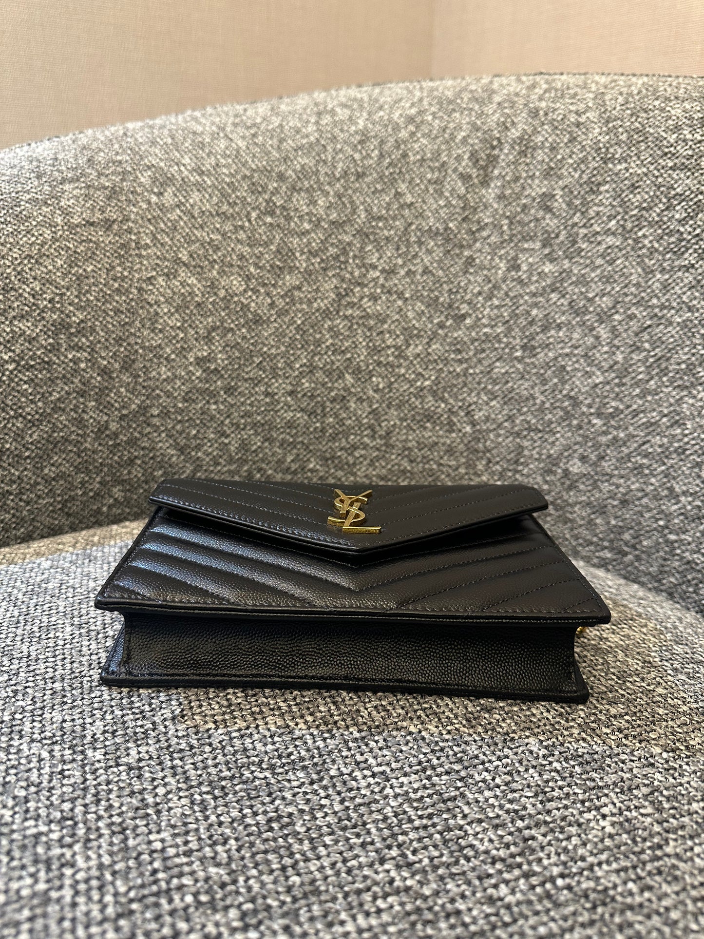Yves Saint Laurent Cassandre WOC in Quilted Black Leather with Gold Hardware