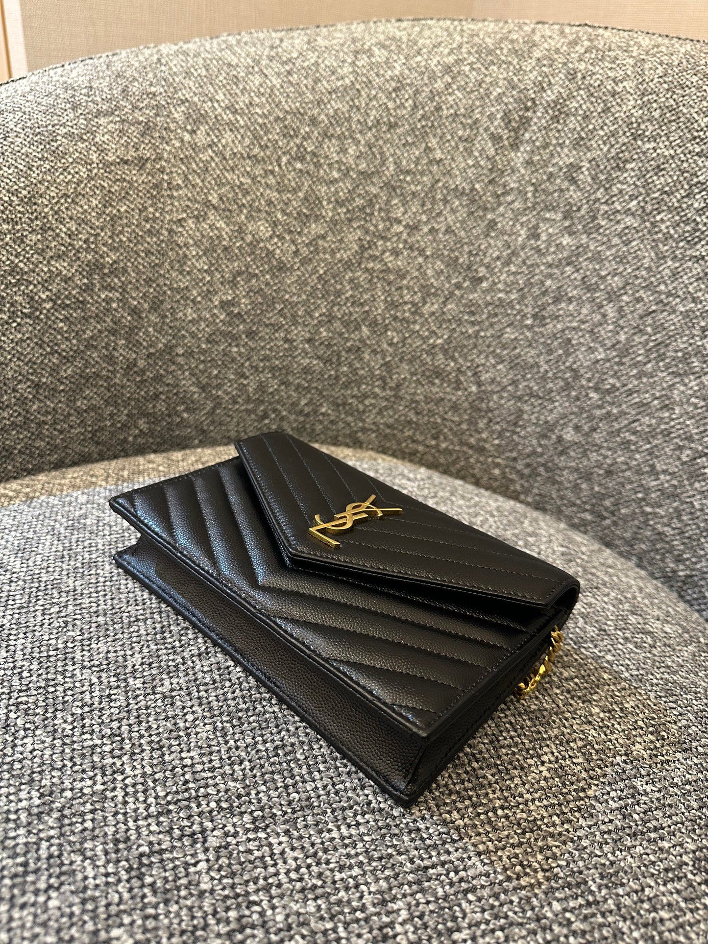 Yves Saint Laurent Cassandre WOC in Quilted Black Leather with Gold Hardware