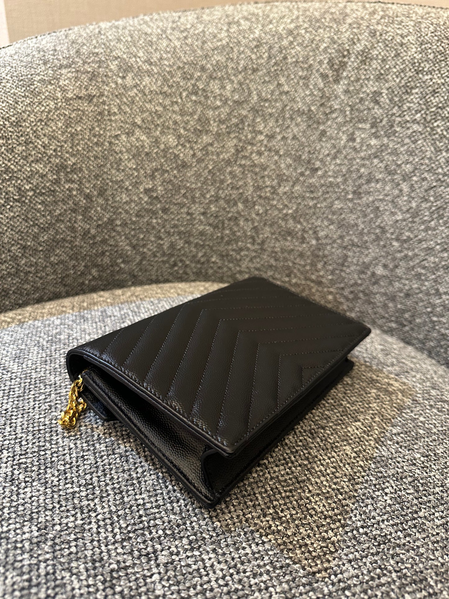 Yves Saint Laurent Cassandre WOC in Quilted Black Leather with Gold Hardware