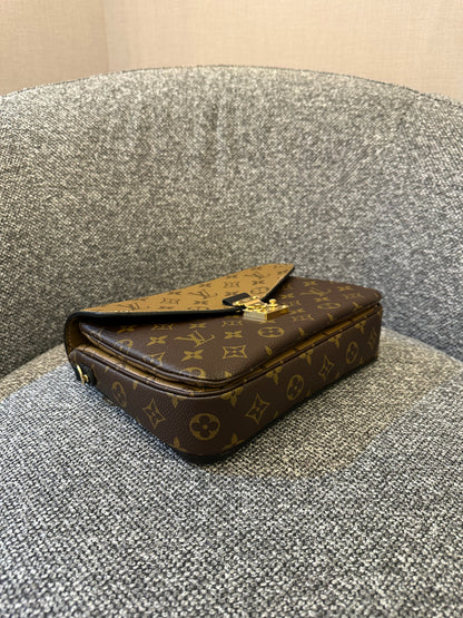 Louis Vuitton Metis Bag in Reverse Monogram Canvas