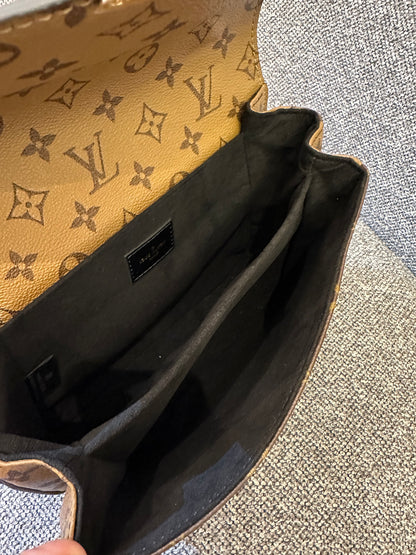 Louis Vuitton Metis Bag in Reverse Monogram Canvas